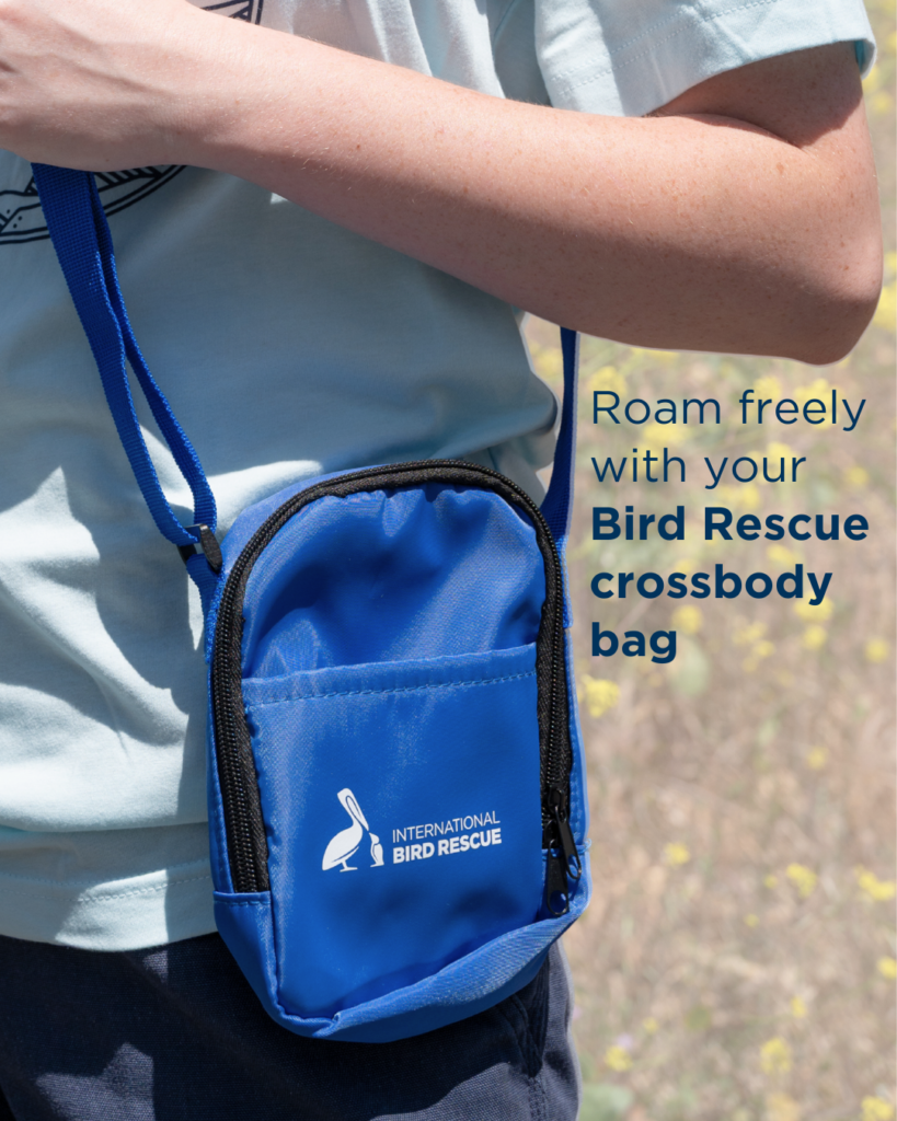 Bird Rescue logo on blue crossbody bag